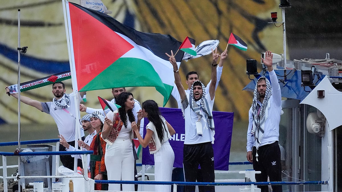 The boat carrying team Palestine makes its way down the Seine in Paris, France, during the opening ceremony of the 2024 Summer Olympics, Friday, July 26, 2024. - (AP Photo/Rebecca Blackwell)